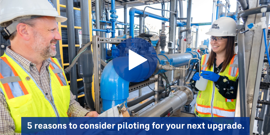 Video still of two engineers smiling with the caption text '5 reasons to consider piloting for your next upgrade'